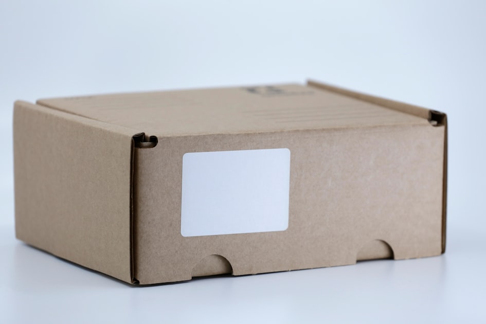 brown cardboard box on white table — Cách Gửi Hàng Viettel Post Từ A-Z - Hướng Dẫn Chi Tiết 2026