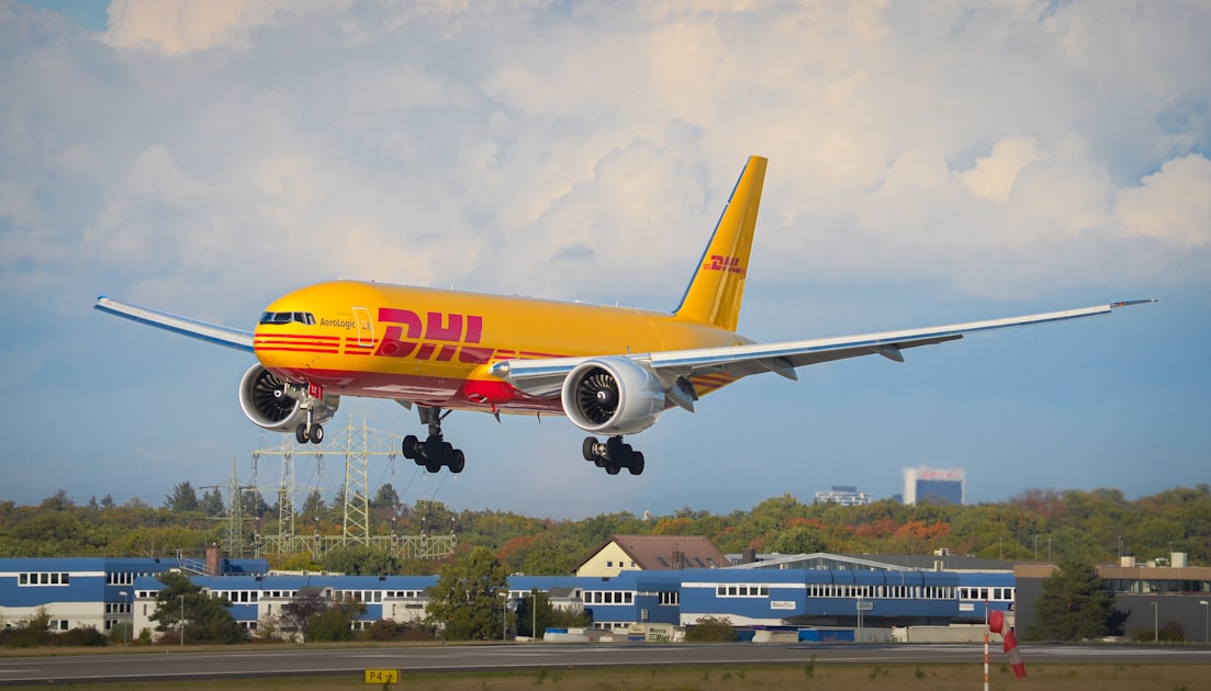 A dhl cargo plane lands on a runway — Tra Cứu Vận Đơn Viettel Post - Kiểm Tra Đơn Hàng Nhanh