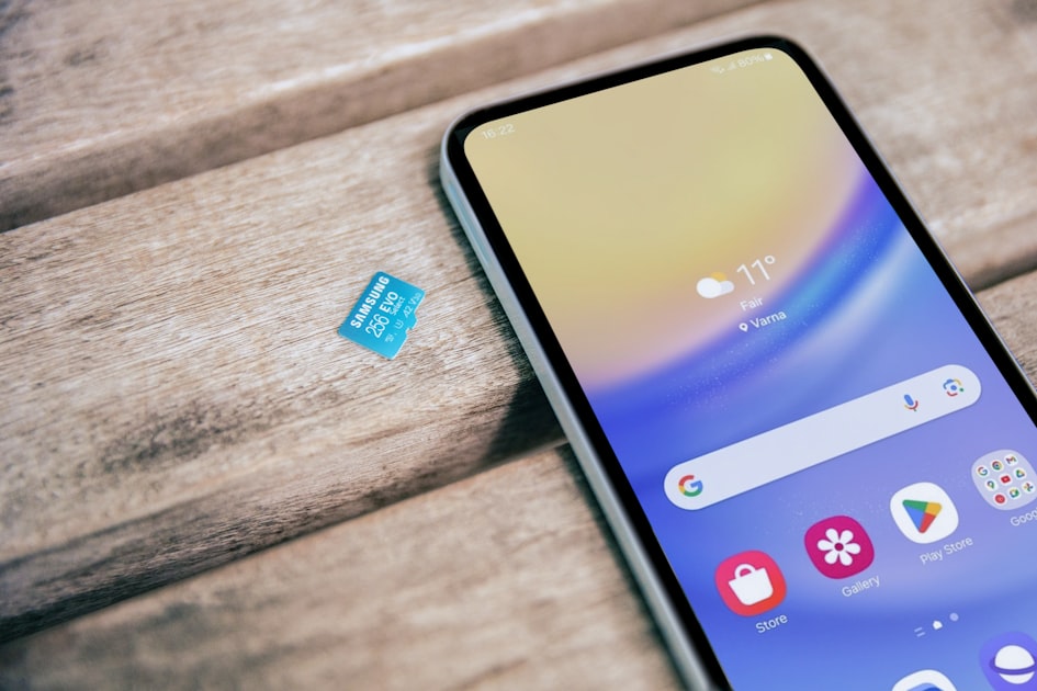 A cell phone sitting on top of a wooden table — Đổi Sim 4G/5G Viettel Giữ Số Đẹp — Miễn Phí Tại Cửa Hàng