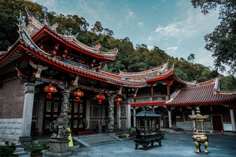 a chinese building with a fountain in front of it — Quẻ Hỏa Thủy Vị Tế - Luận Số Điện Thoại Kinh Dịch