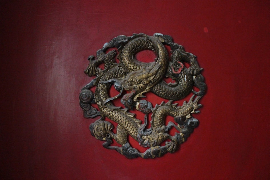 Hidden on the doors of aging apartments in Taipei's older districts, these brass dragon carvings are a quiet reminder of t...