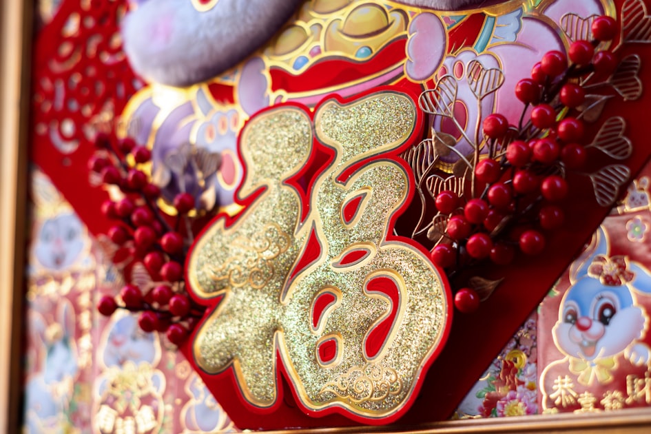 a close up of a red and gold decoration — Sim Hợp Tuổi Sửu (Trâu) - Số Đẹp & Mệnh
