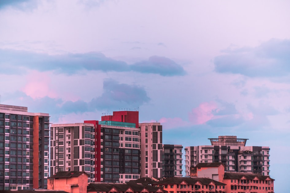 Apartment buildings under a cloudy pink and blue sky — Viettel 5G Tại Ocean Park - Khi Nào Có? Cập Nhật
